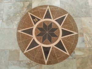 This compass mosaic in the entry is a nod to a career in the U.S. Navy.