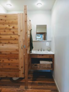 Floating vanity and bathroom stall