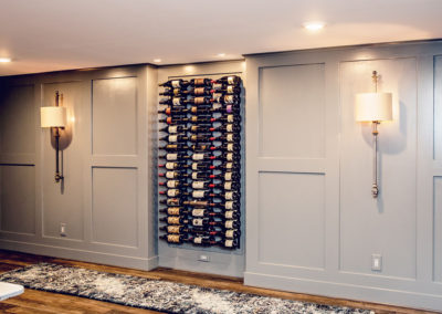 gray wainscoting with built in wine wall