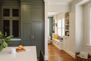 The open space between the kitchen and living room visually connects the two from the seating area in the kitchen to the cozy bench nook, making the new space perfect for entertaining.