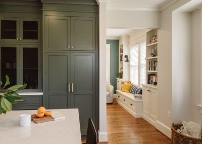 The open space between the kitchen and living room visually connects the two from the seating area in the kitchen to the cozy bench nook, making the new space perfect for entertaining.