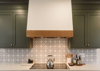 custom plaster vent and fireclay tile backsplash, custom cabinetry