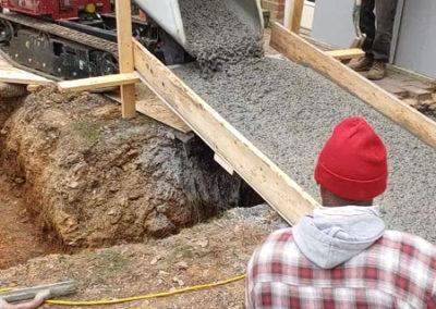 cement being poured for foundation for swim spa