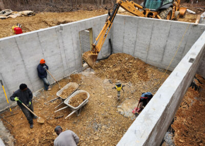 January 30, 2023 - grading and filling in footers & drain tile with earth from excavation