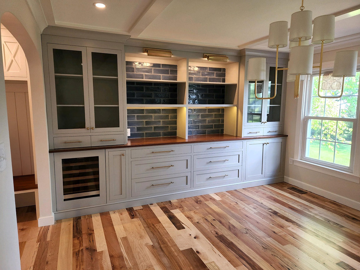 Kitchen with custom flooring and custom wood cabinetry