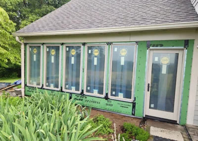 new Pella patio door with casement windows, ZIP System as a vapor barrier to shield from weather and elements.