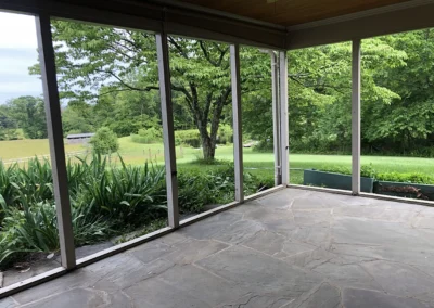 before removal of original screen structure and flagstone patio.