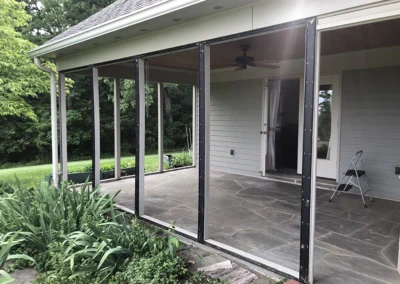 Old screen structure removed for new framing of walls and windows.